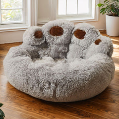 Large plush donut dog bed with removable cover in paw print design