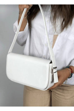 White artificial leather mini baguette bag with flap closure