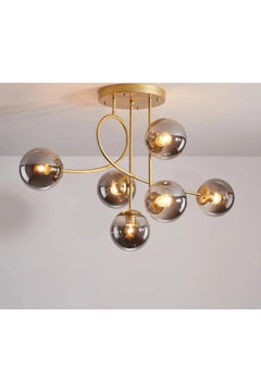 6-light gold chandelier with smoked glass shades for stylish interiors
