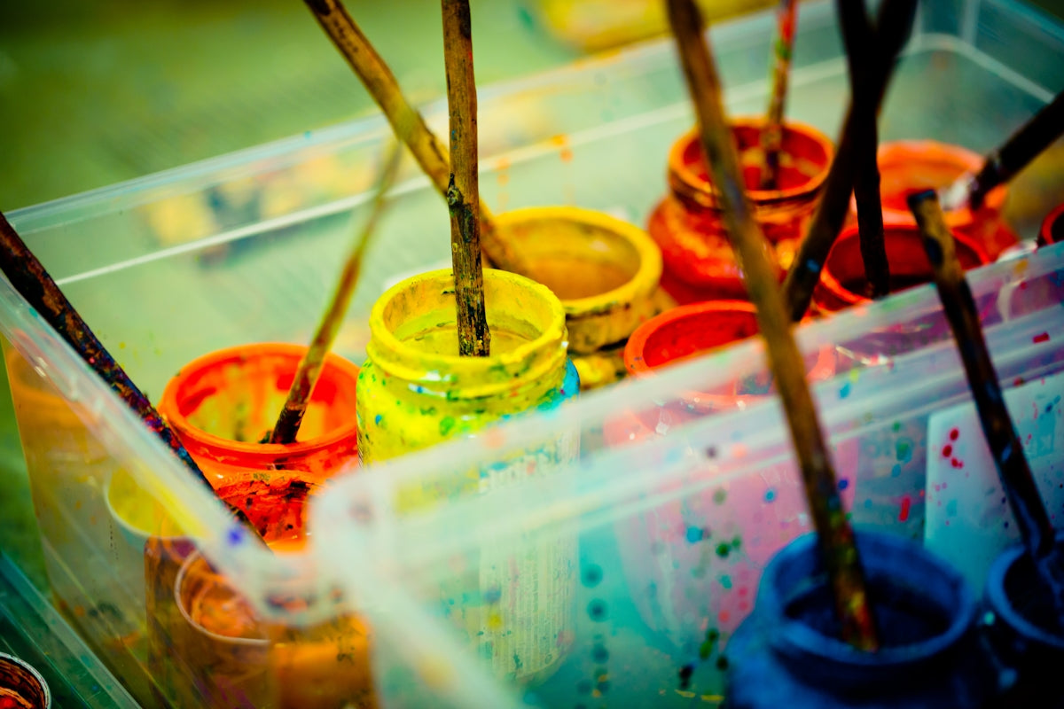 yellow green and red paint cans