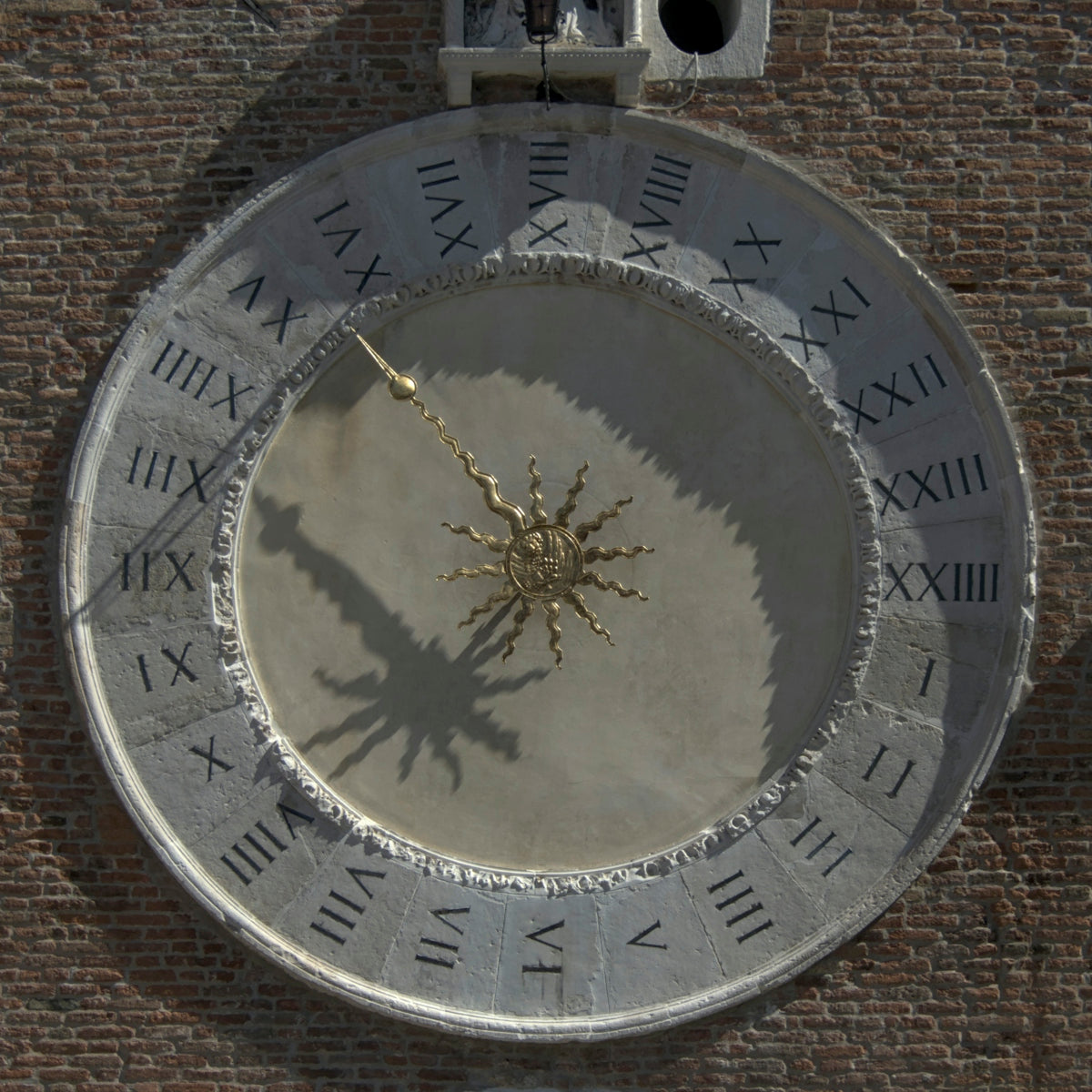 a clock on a brick wall