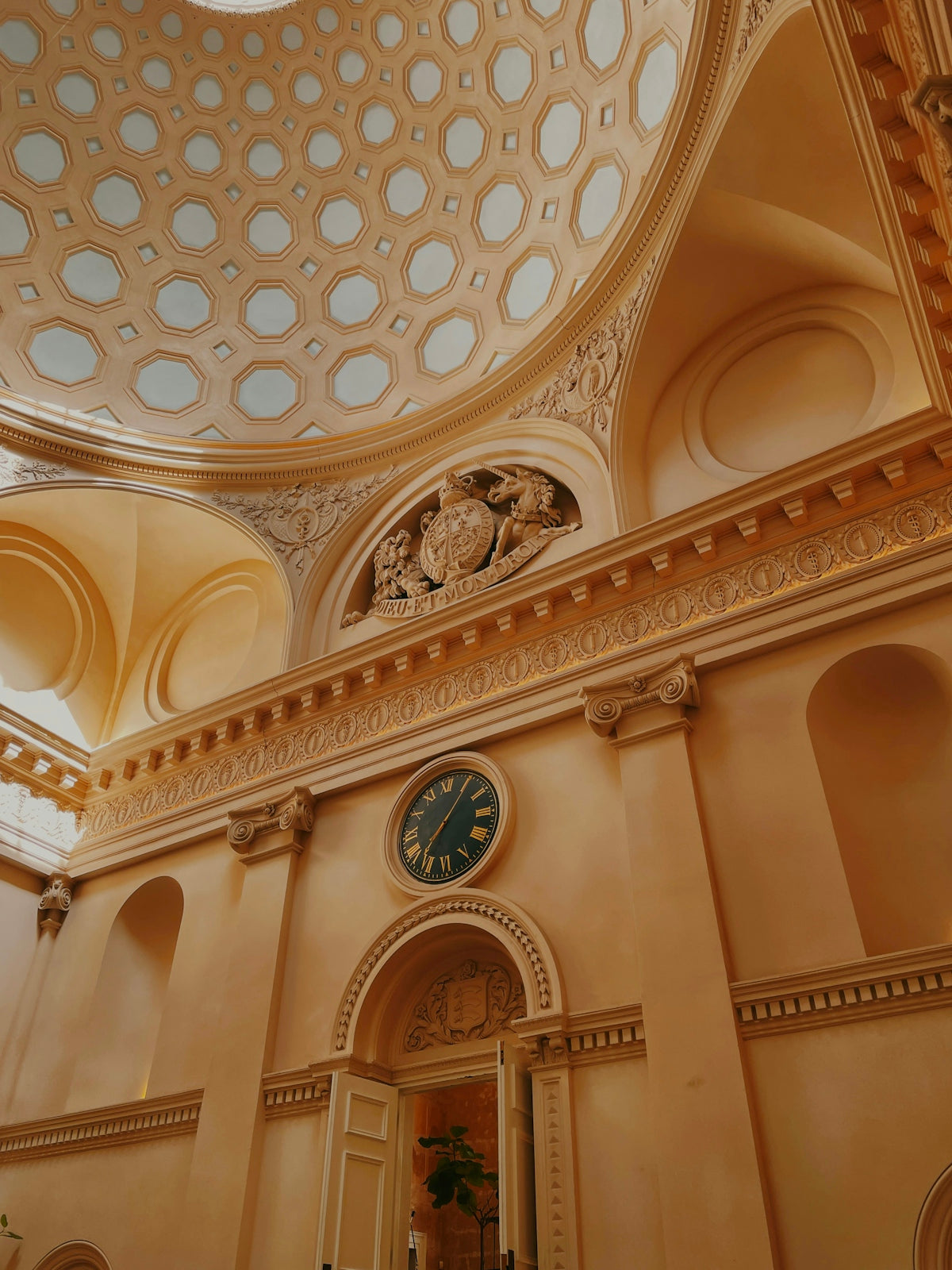 a clock mounted to the ceiling of a building