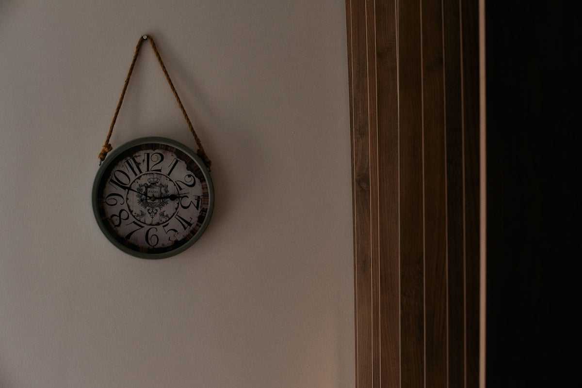 a clock hanging on the wall of a room