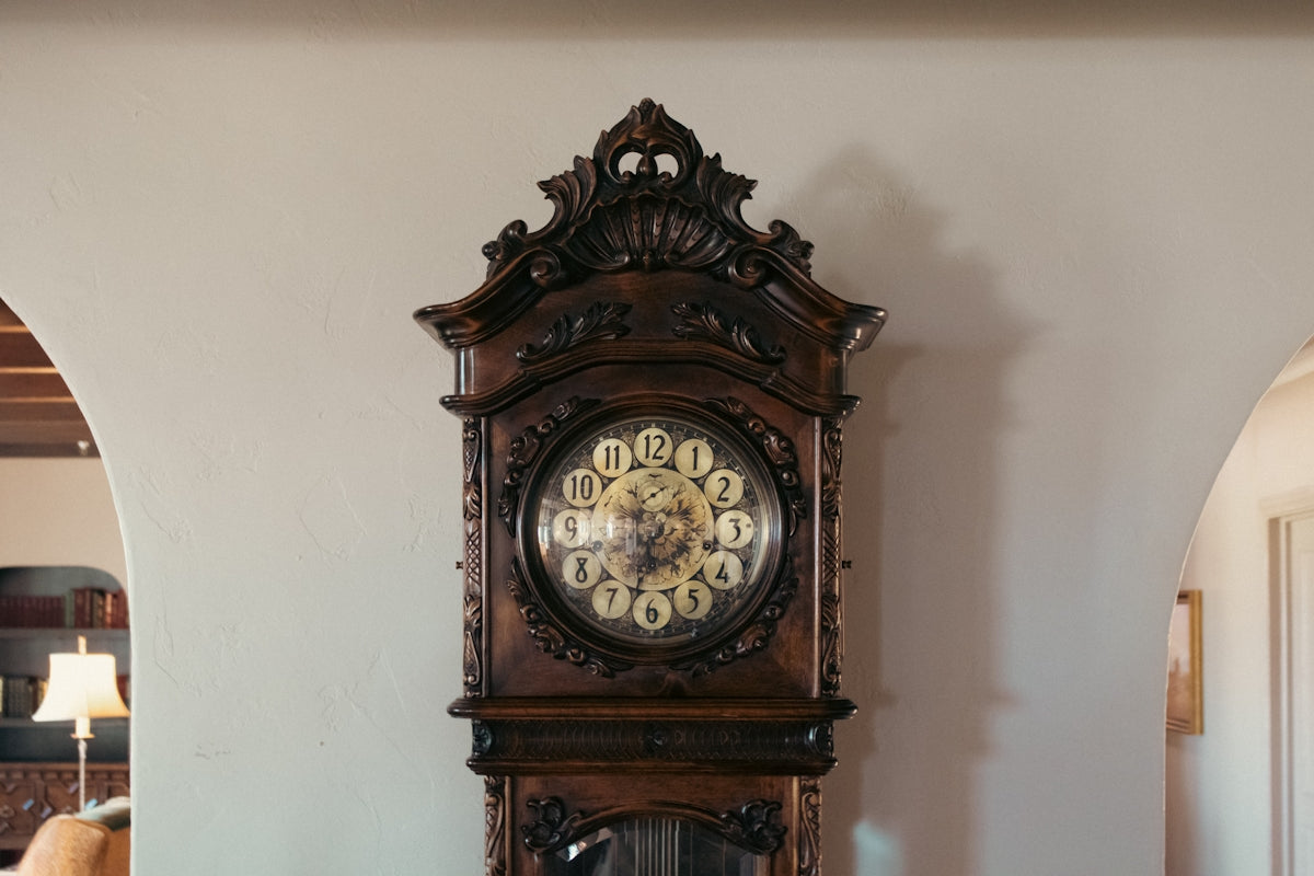 A grandfather clock sitting on top of a table