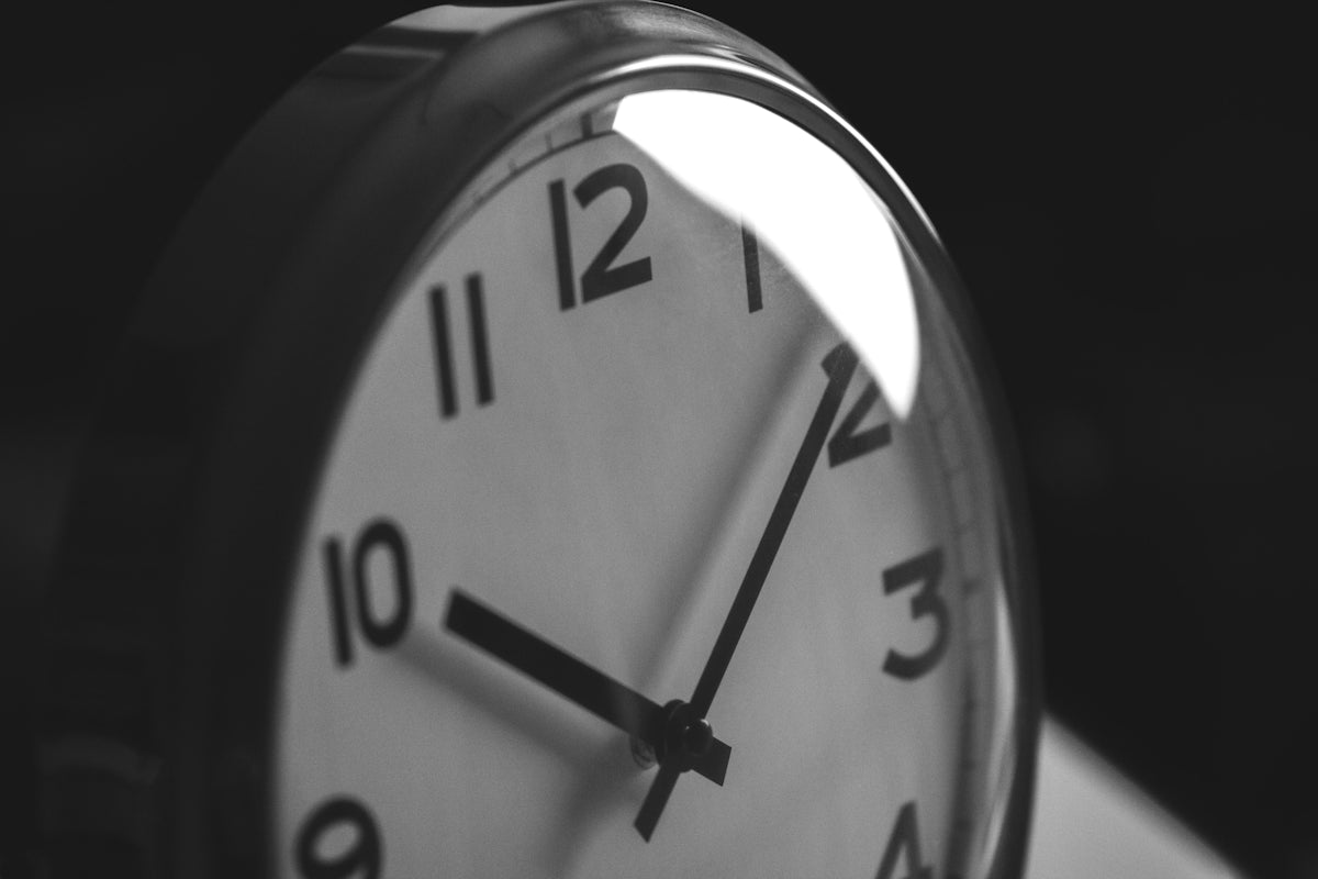 A black and white photo of a clock