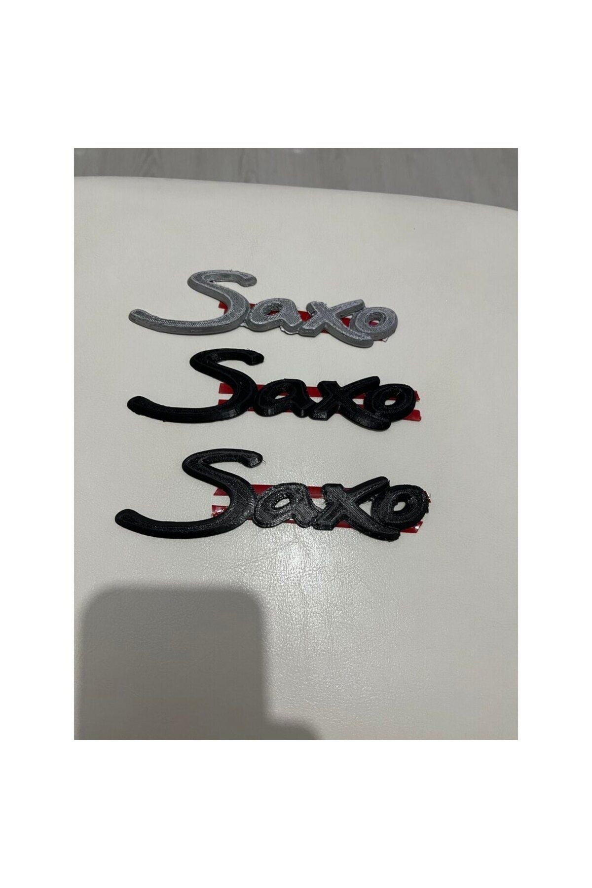 Saxo emblem badge