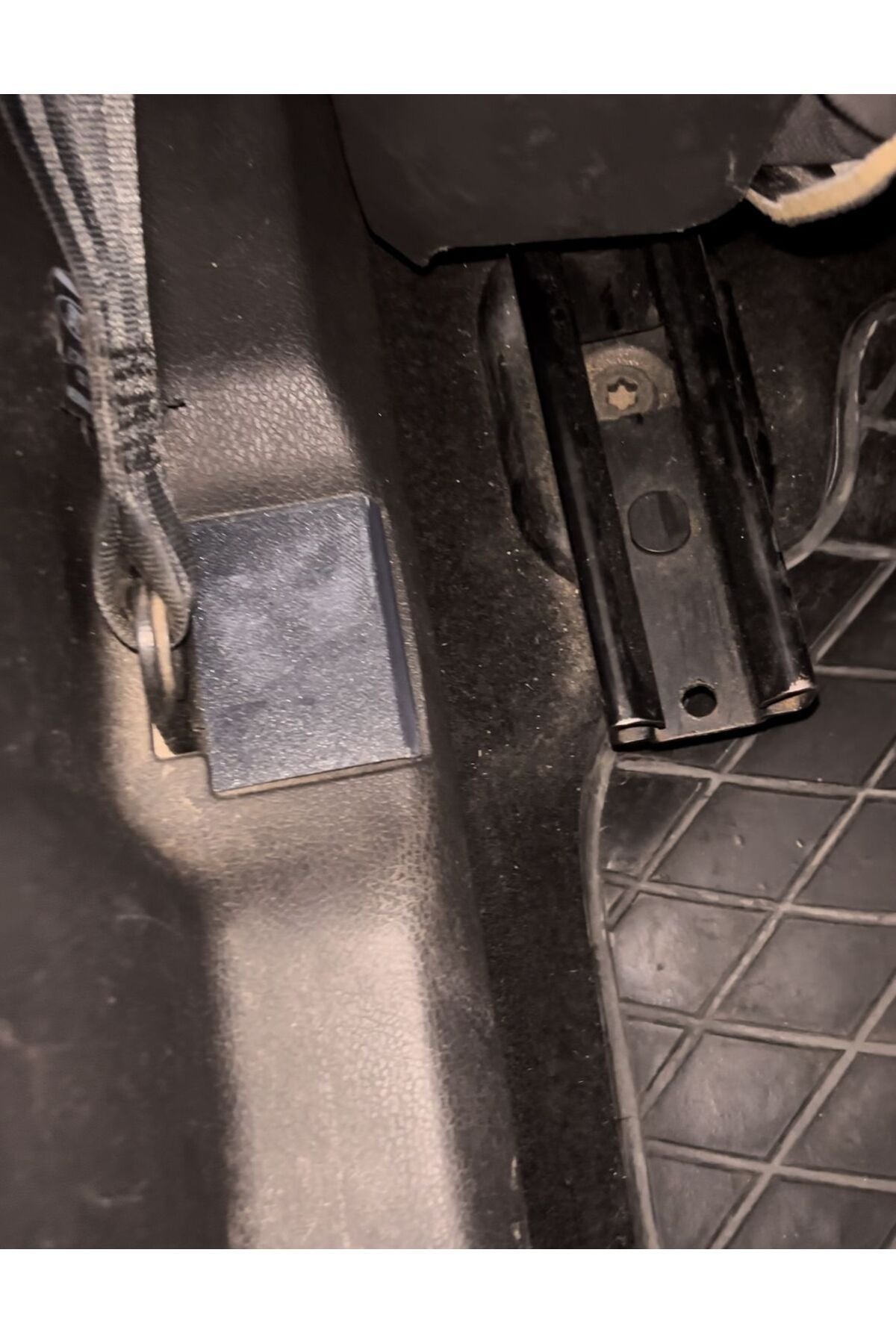 Where the Ford Connect seat belt attaches to the floor