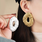 Make a Statement with Oversized Metal Earrings