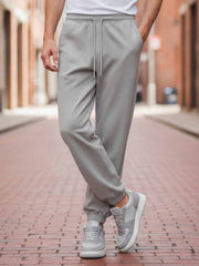 Men's Casual Pants with Anti-Wrinkle Fabric, Elastic Fit, and 9-Inch Length