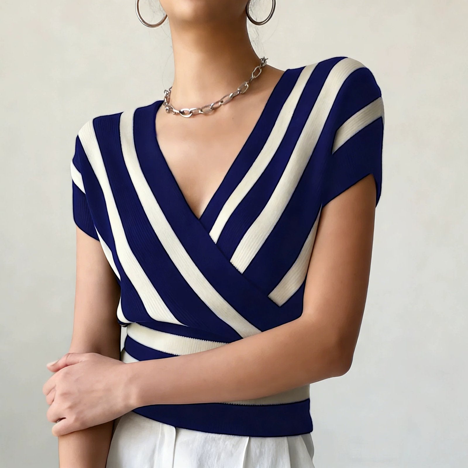 Elegant Striped Top with Cross-Neckline & Defined Waist