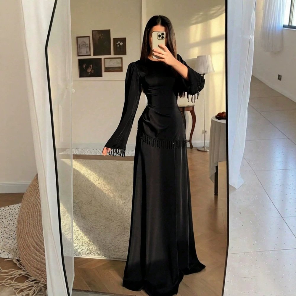 Elegant Minimalist Dress with a Fitted Waist and Tassel Detailing