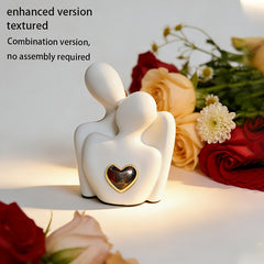 Modern love embrace sculpture with golden heart home decor
