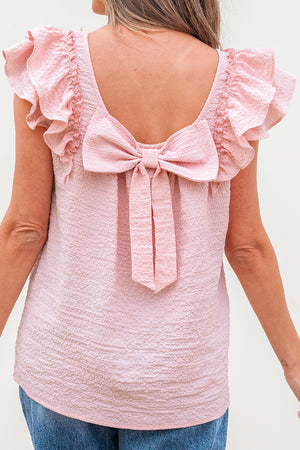 Zartrosa Bluse mit Strukturmuster, Schleife und Rüschen, Schmetterlingsärmeln