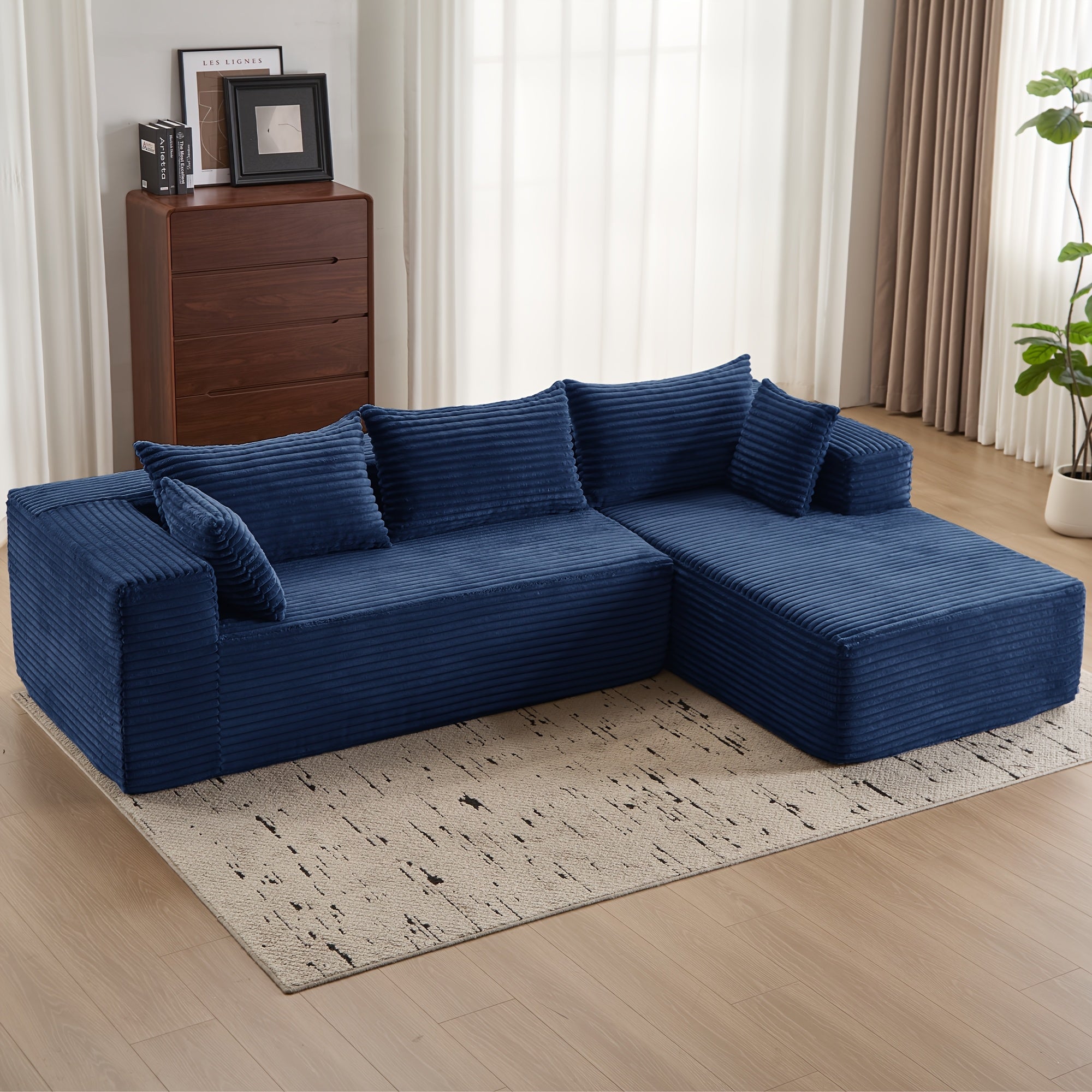Modular L-shaped chaise longue sofa bed with deep seat and corduroy upholstery
