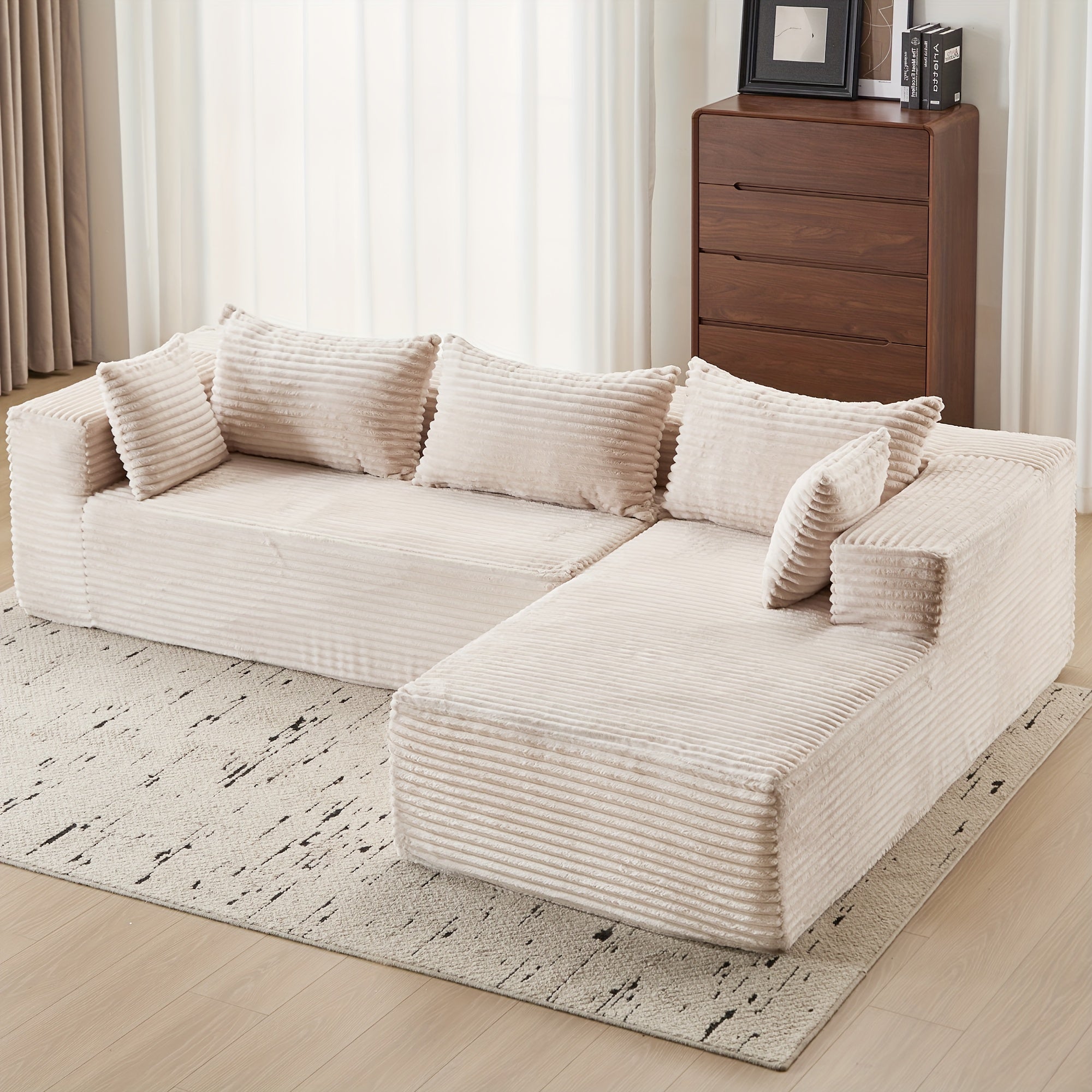 Modular L-shaped chaise longue sofa bed with deep seat and corduroy upholstery