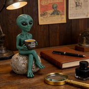 Green alien book lover figurine for sci-fi themed desk decor
