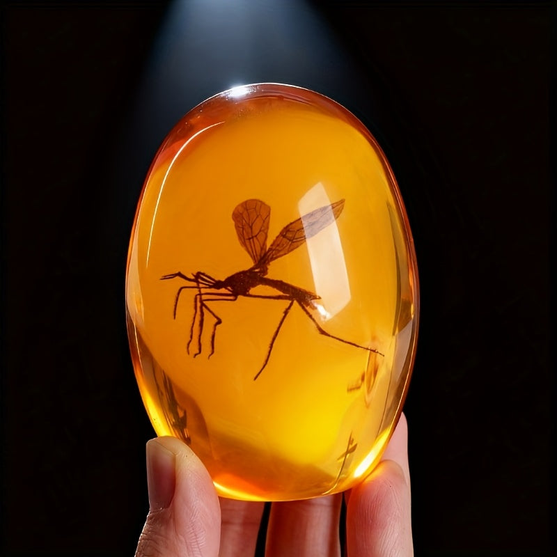 Amber resin mosquito paperweight with dinosaur theme