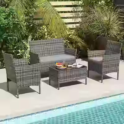4-piece outdoor patio furniture set with washable cushions and glass table