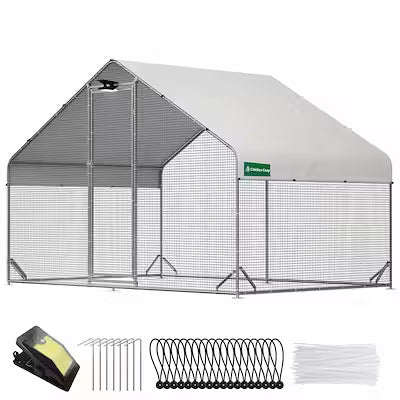 Walk-in metal chicken coop with attached run and solar-powered lighting