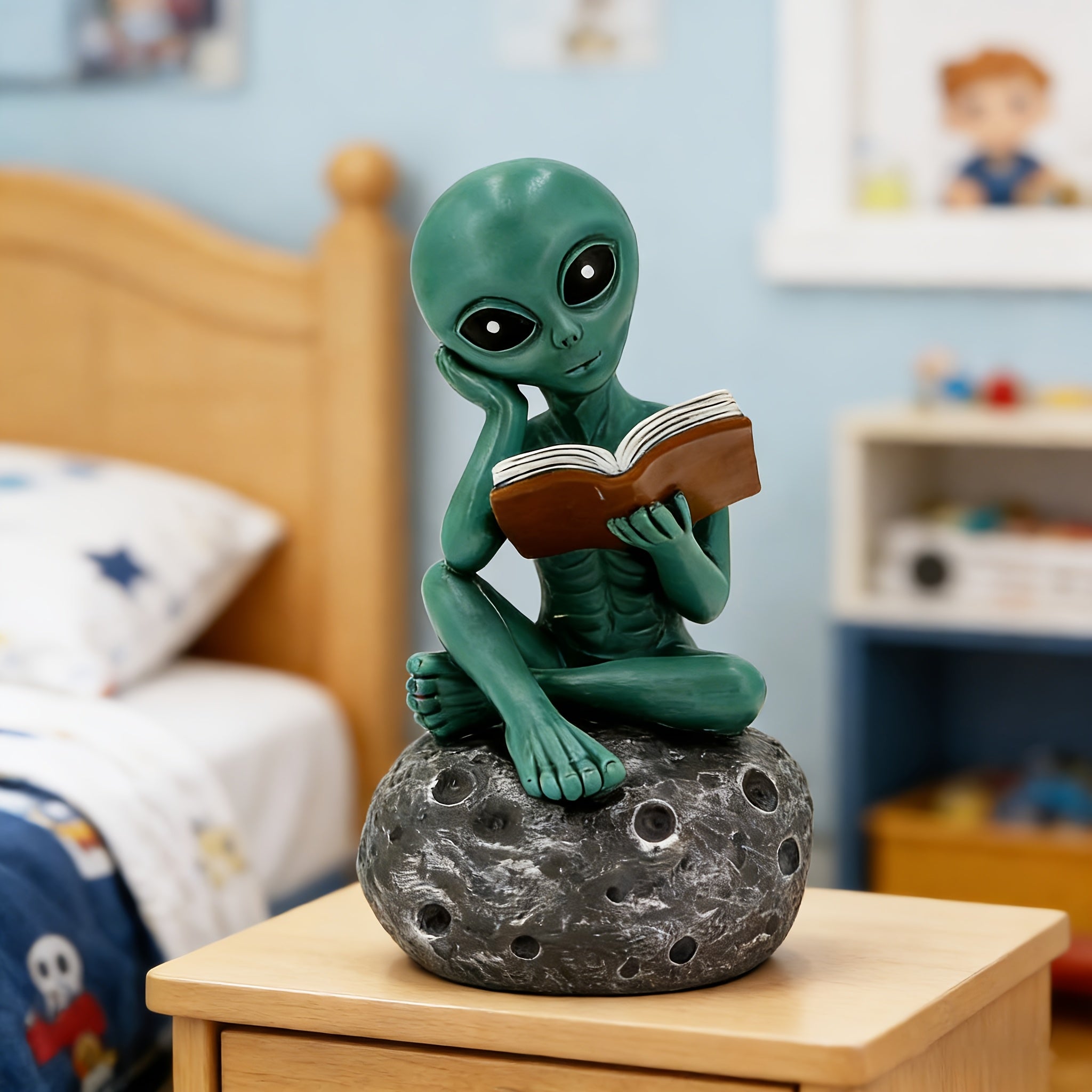 Green alien book lover figurine for sci-fi themed desk decor