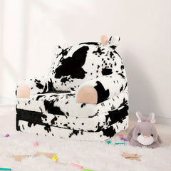 Plush toddler cow-print chair with removable cover