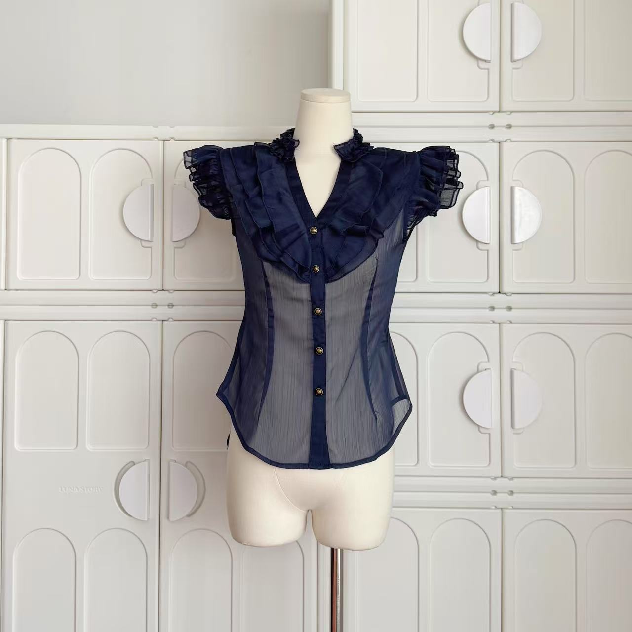 Sleeveless Chiffon Top With A Chic Ruffled Trim