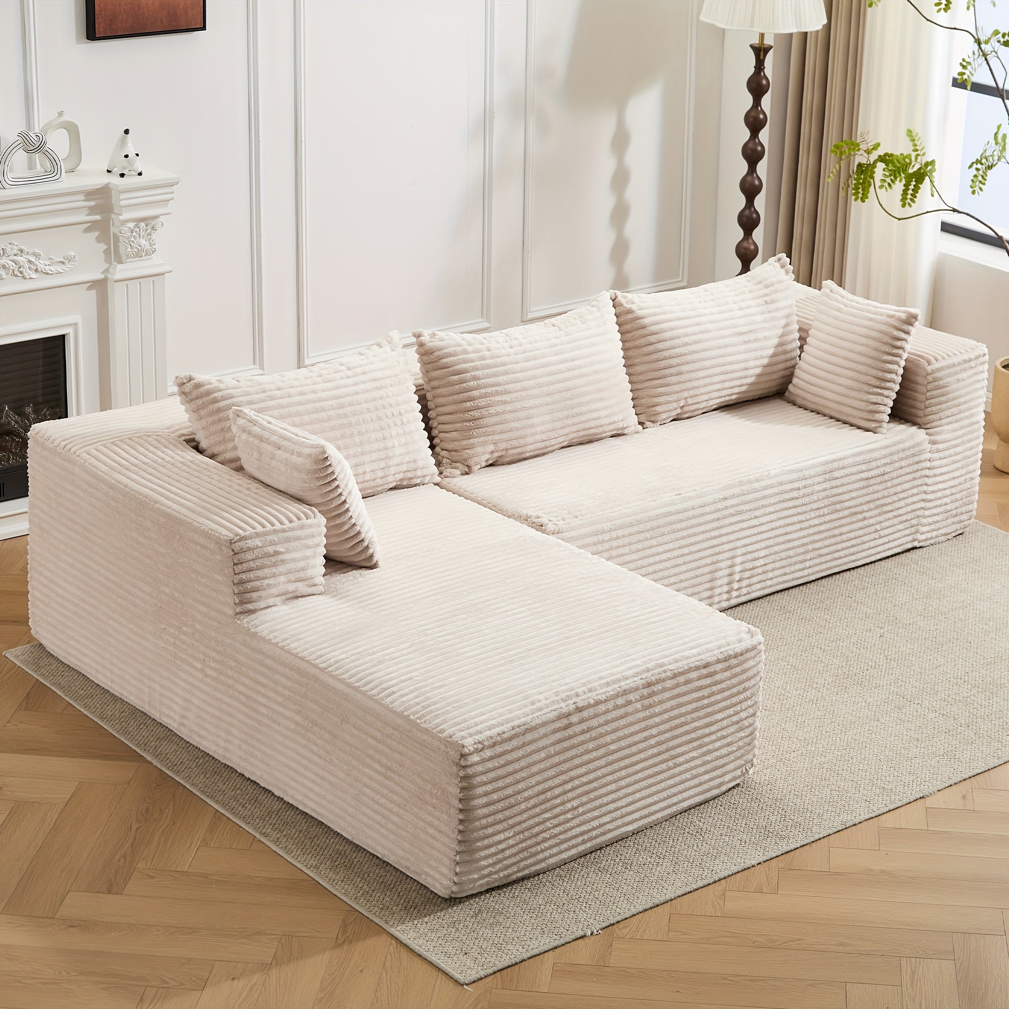Modular L-shaped chaise longue sofa bed with deep seat and corduroy upholstery