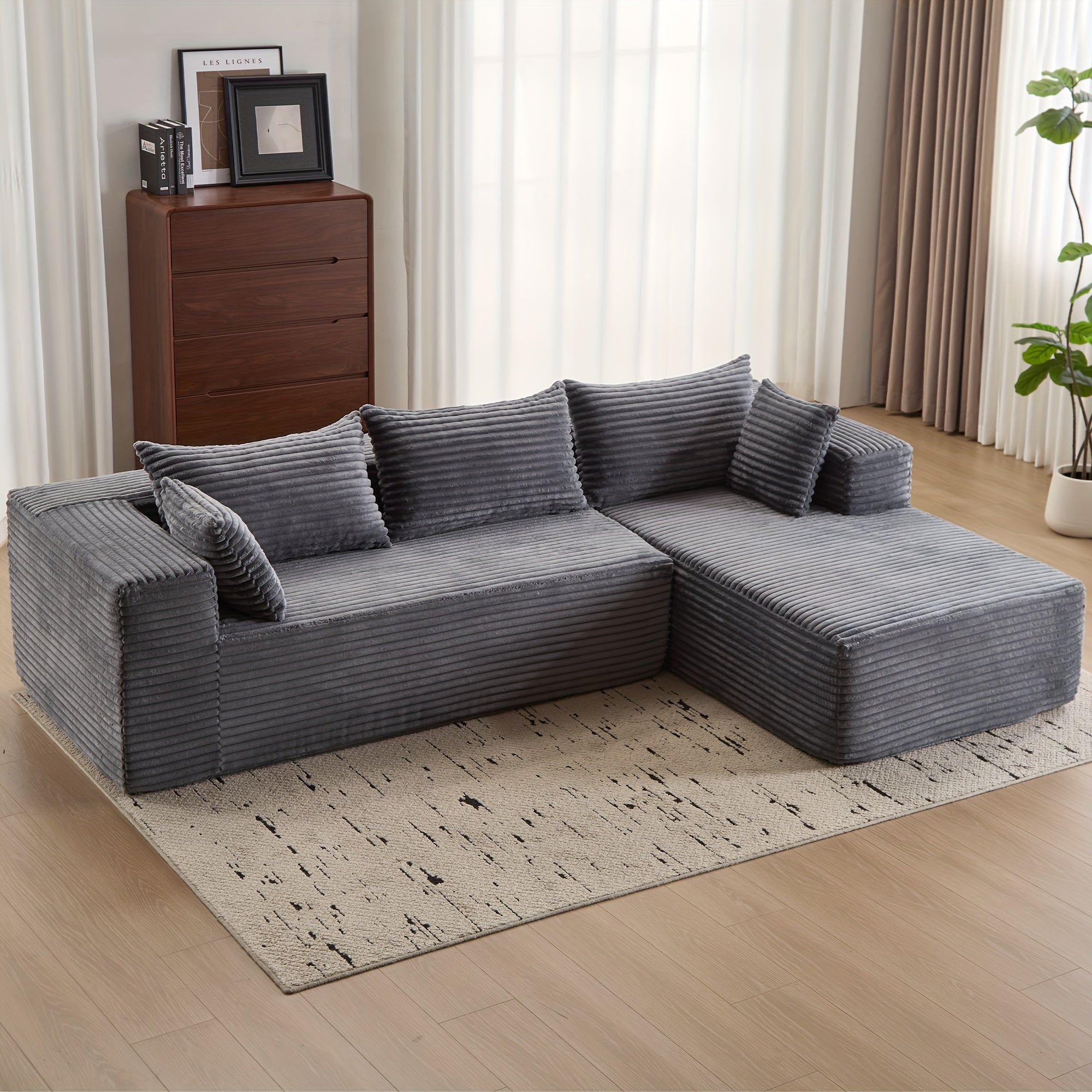 Modular L-shaped chaise longue sofa bed with deep seat and corduroy upholstery