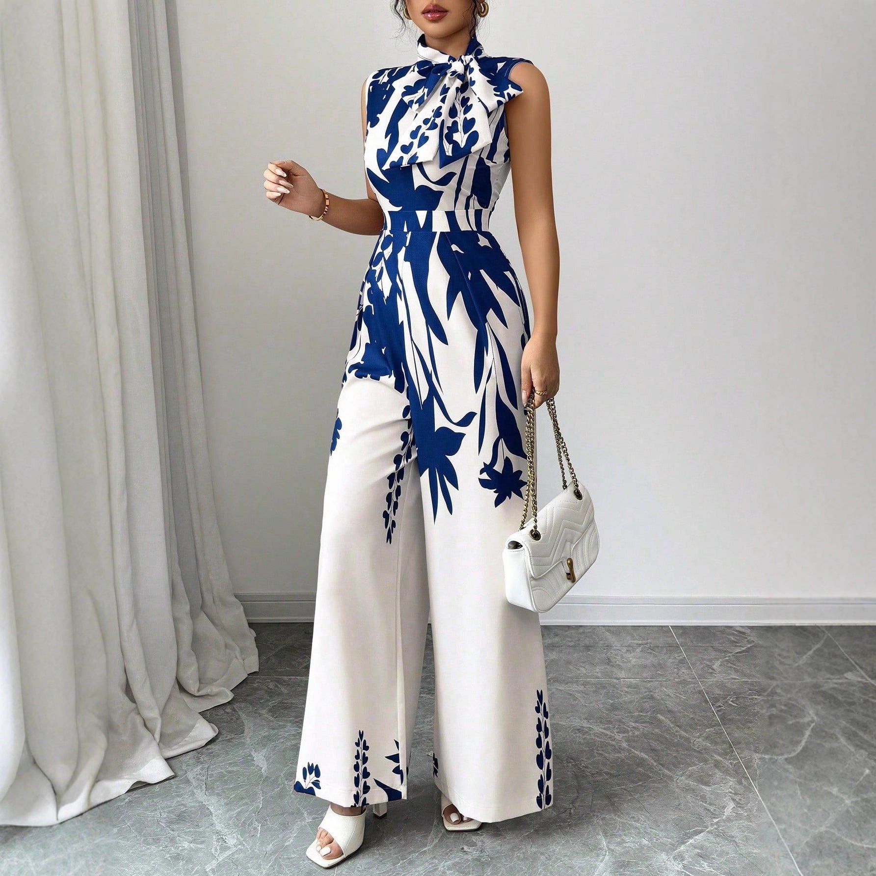 Elegant Womens Sleeveless Wide-Leg Jumpsuit With Floral Print And Lace-Up Details