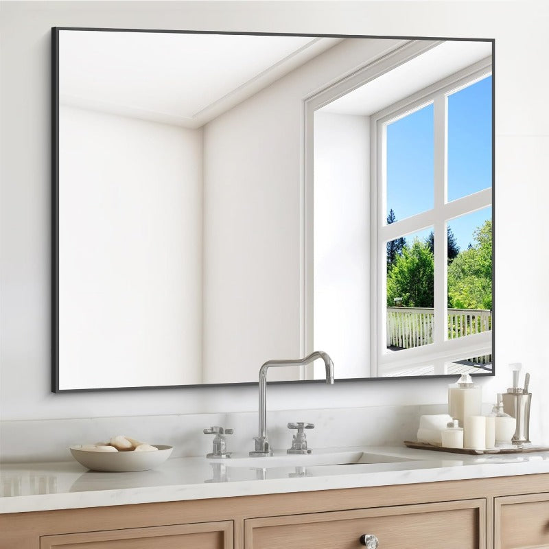 Modern black and gold rectangular wall mirror with thin frame