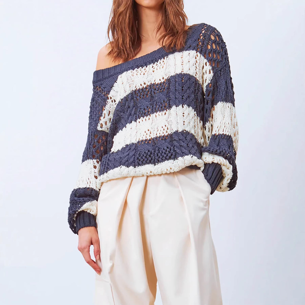 Womens Knitted Sweater with a Round Neck Long Sleeves and a Striped Hollow-out Design