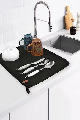 Black dish drying mat with hanging rope for countertop protection