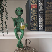 Alien holding beer mug desk figurine for sci-fi humor decor
