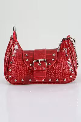 Red crocodile-patterned handle bag with metallic staples and dust bag