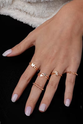Five-piece adjustable ring set with butterfly and leaf motifs