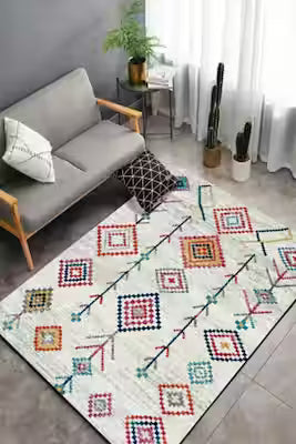 Machine-washable chenille rug with dot-patterned design and non-slip backing