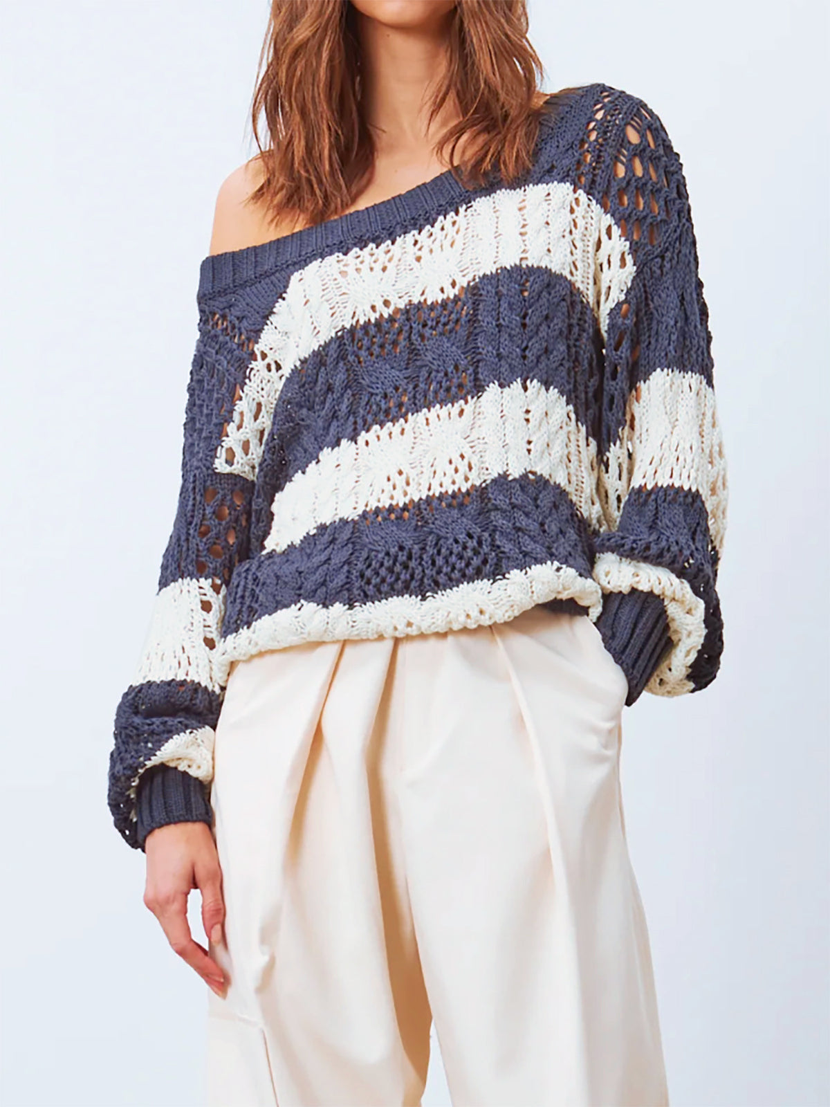 Womens Knitted Sweater with a Round Neck Long Sleeves and a Striped Hollow-out Design