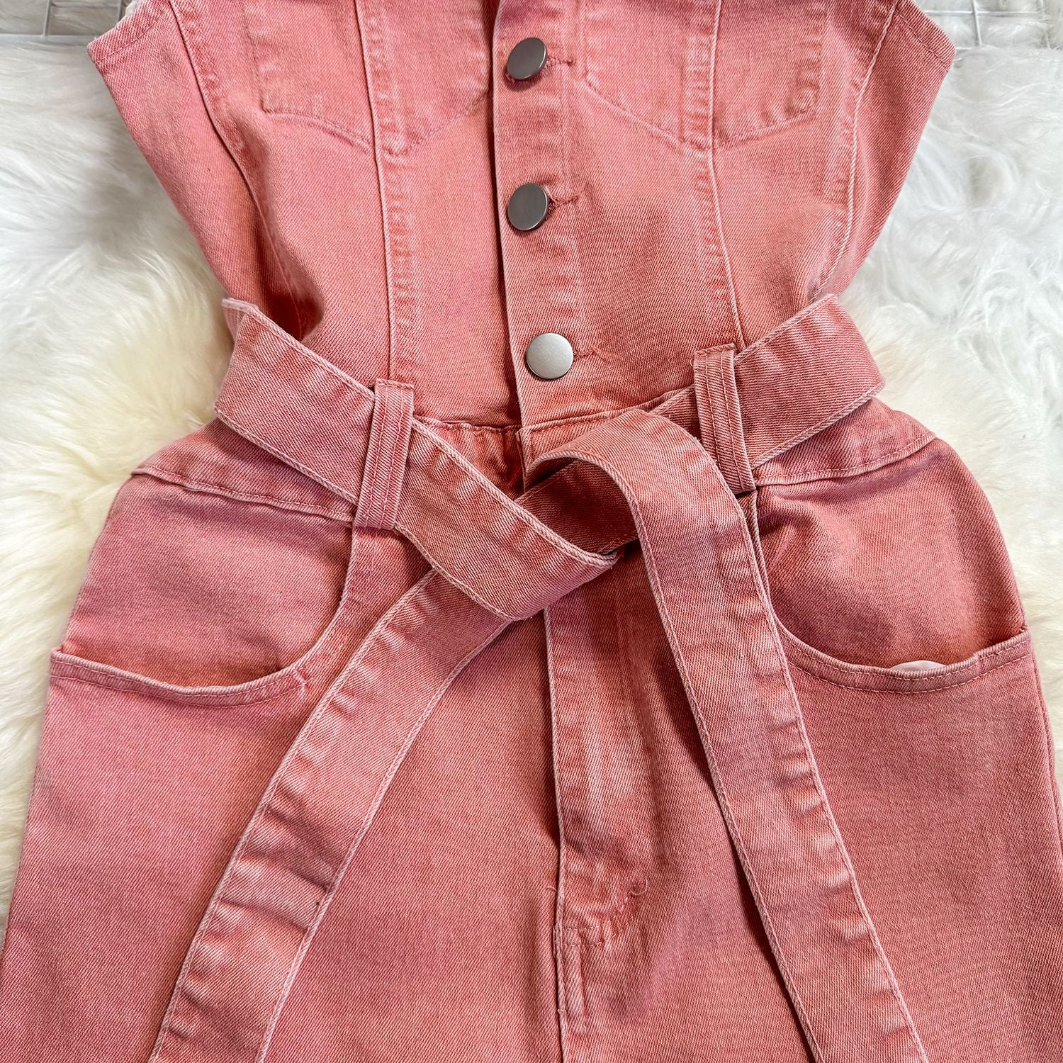 Chic Pink Denim Jumpsuit with Waist-Controlling Belt