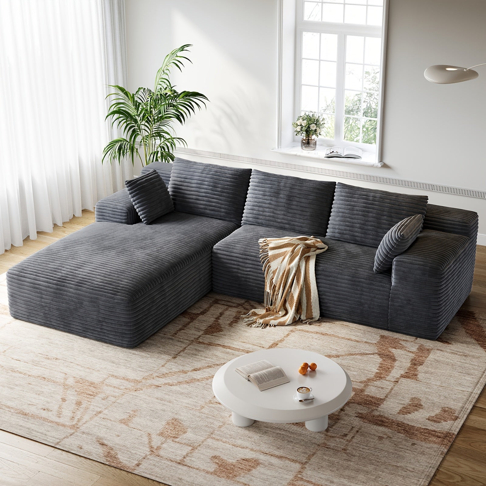 Modular L-shaped chaise longue sofa bed with deep seat and corduroy upholstery