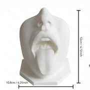 Quirky tongue-out face sculpture for modern home and office desk decor