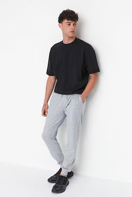 Regular fit grey sweatpants with elastic cuffs for men