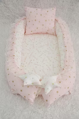 Pink portable baby nest and travel sleep pod with removable pillow