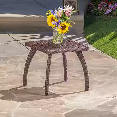 Brown rattan side table with wicker finish for outdoor patio