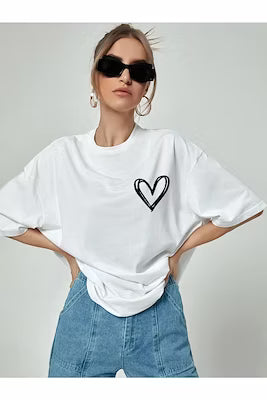 White oversize t-shirt with minimal heart print