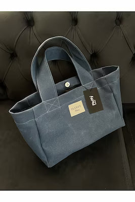 Waxed canvas shoulder bag with laptop compartment