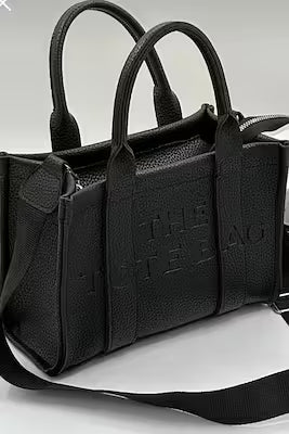 Minimalist leather tote bag with adjustable strap