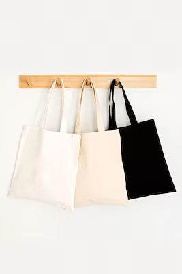 Black, white, and cream colored tote bag with natural fabric