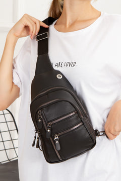 Waterproof crossbody bag in black vegan leather with multiple compartments