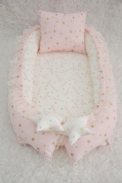 Pink portable baby nest and travel sleep pod with removable pillow