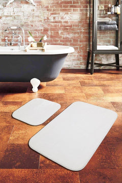 Plush white bath mat for soft, absorbent comfort